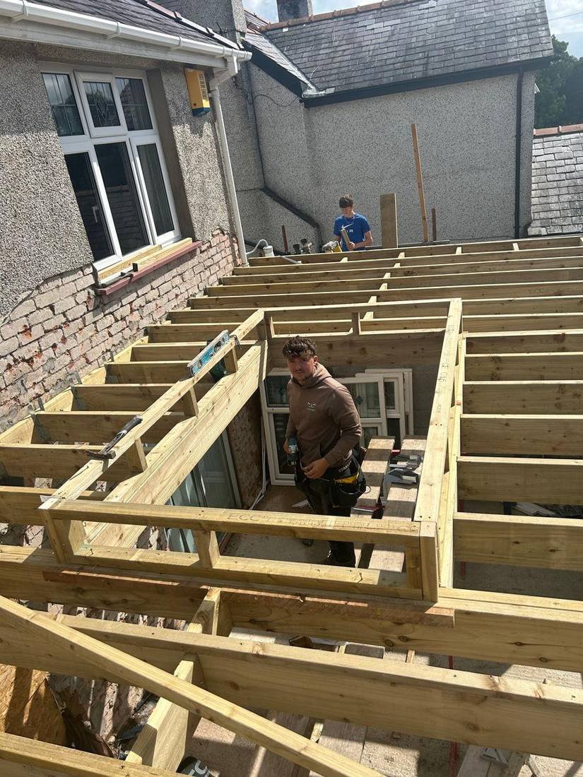 Timber floor joists being fitted