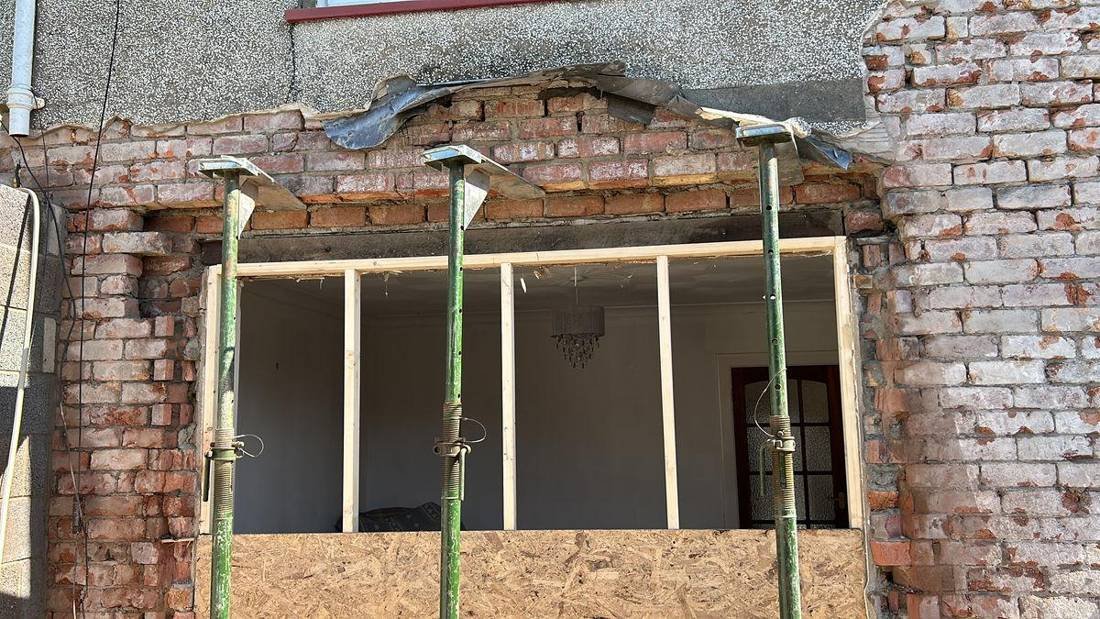 Wall opened up with props for a new steel beam