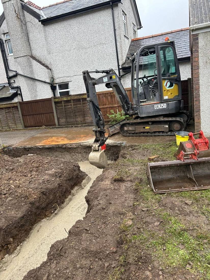 Mini digger preparing a garden