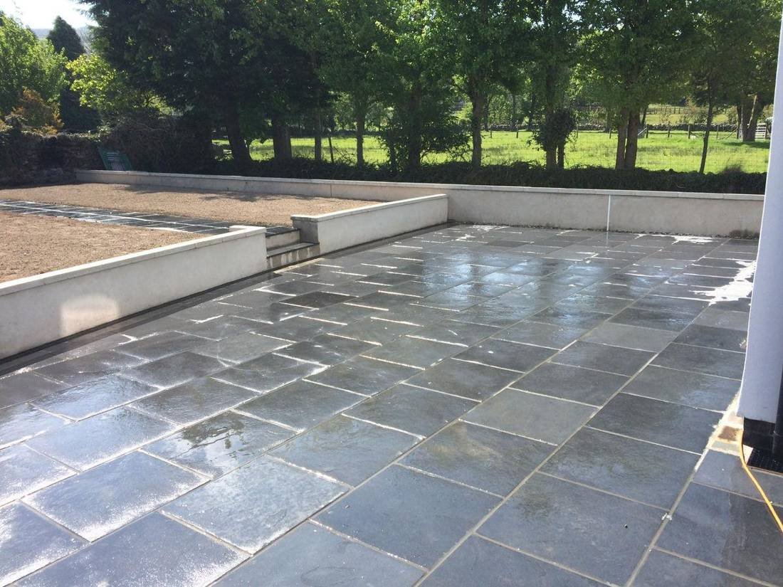 New slate patio with rendered garden walls
